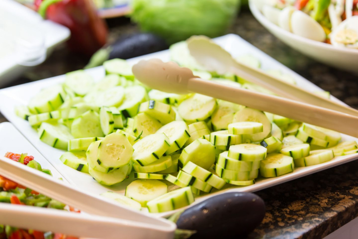 Tray with cucumber slices at the buffet in Es Talaial