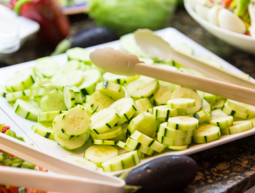 Tray with cucumber slices at the buffet in Es Talaial