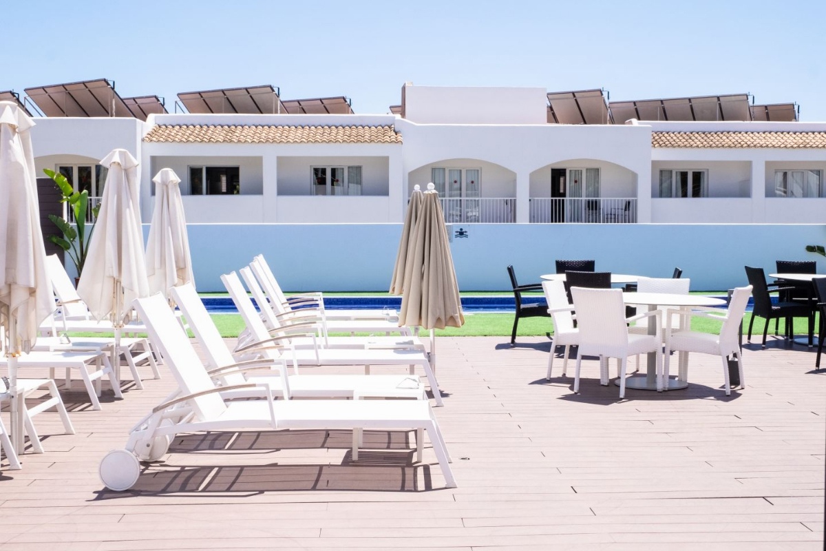 Solarium area with sun loungers, parasols, tables and chairs