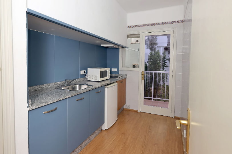 Blue kitchen of 2 bedroom apartment