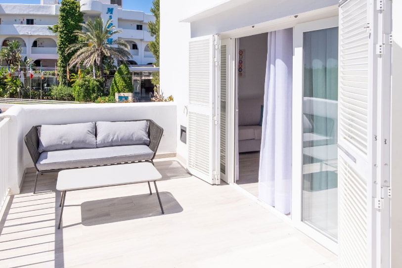 Terrace of the Superior Studio with sofa and outdoor table