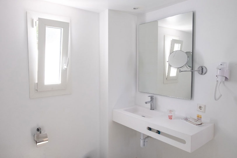 Washbasin with magnifying mirror and hairdryer