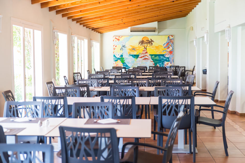 Tables in one of the restaurant areas of Es Talaial